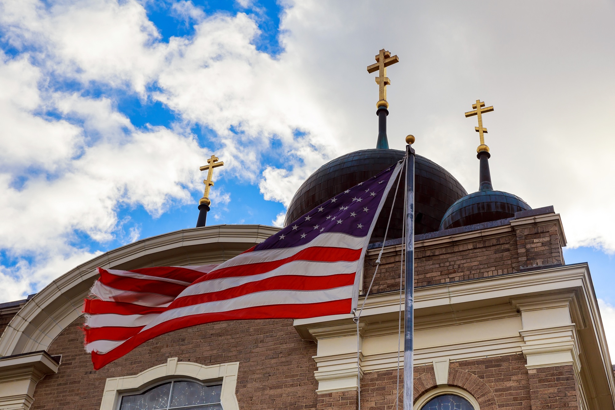 God Bless America American flag and church steeple church sky American Flag God Bless America American flag and church steeple church sky American Flag