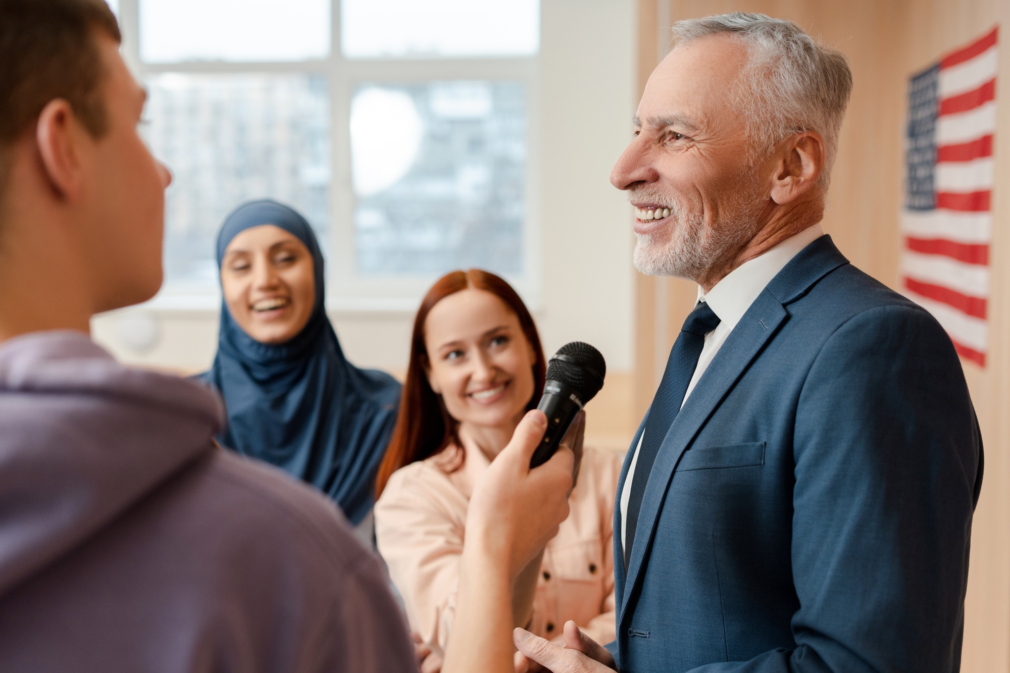 Senior man, politician communication with journalists. Press conference, presidential election Senior man, politician communication with journalists. Press conference, presidential election